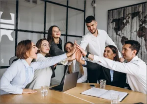 group co-workers giving eachother a high five